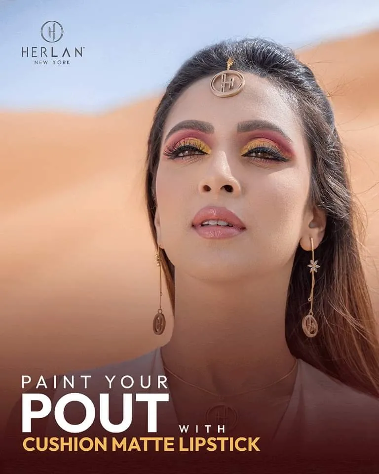 Beauty advertisement of a woman with bronze eye makeup beside the words "Paint your pout" and "Cushion Matte Lipstick"