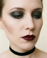 AI-generated reference for the Gothic vampire idea: pale skin, dark smoky eyes and deep burgundy lips